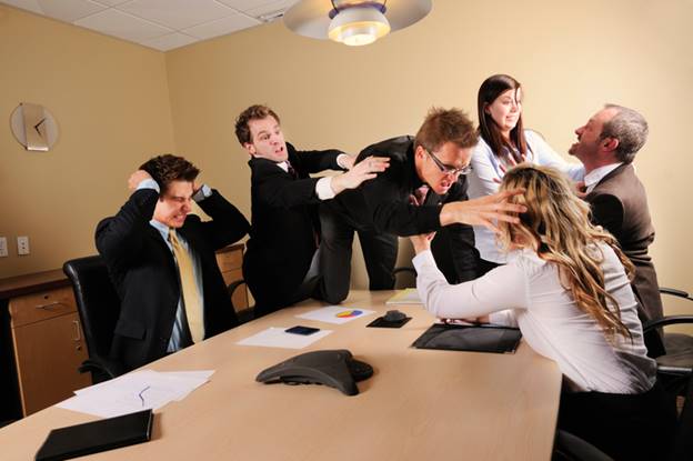 Man jumping over table woman at work - Employment Law